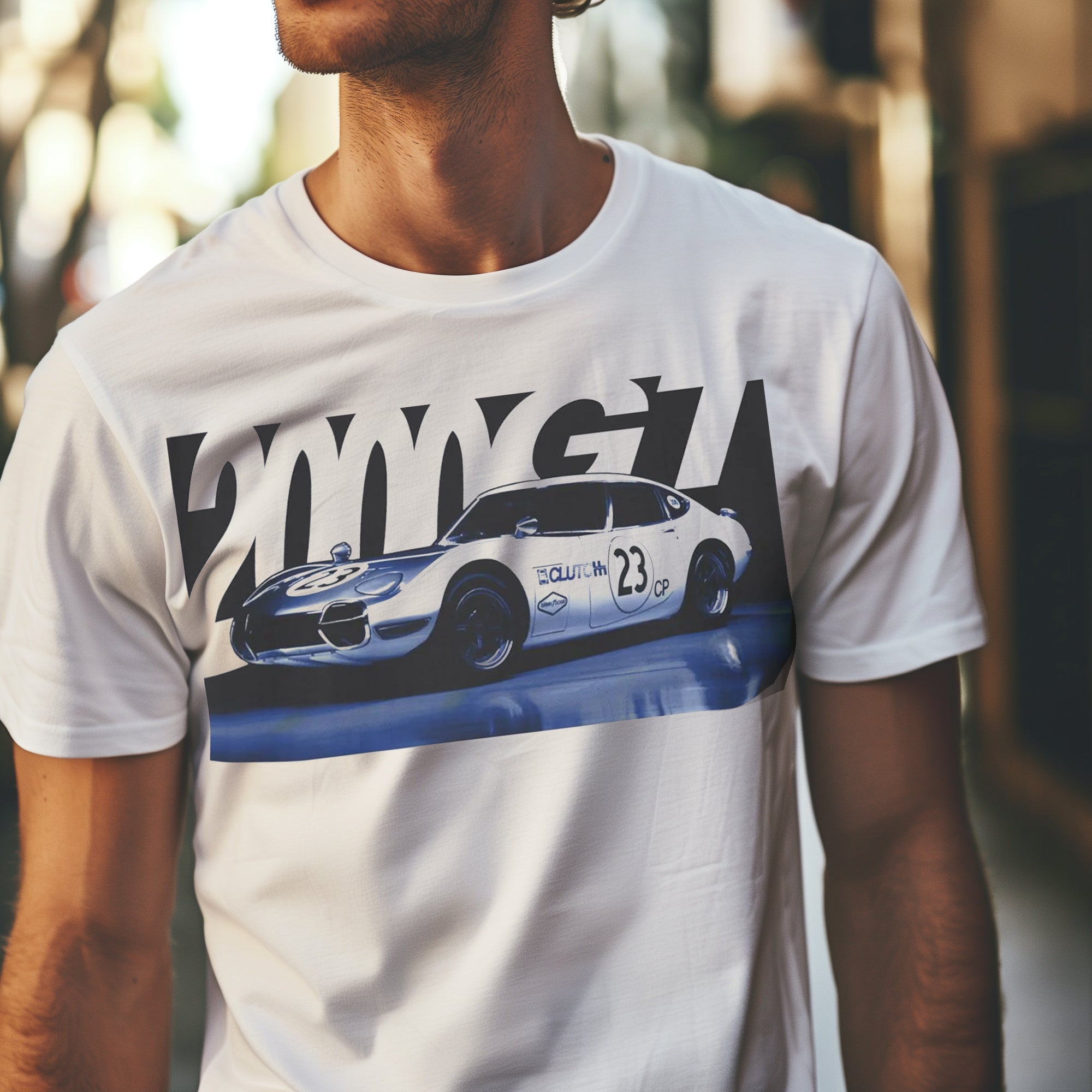 2000GT Automotive Graphic T-Shirt – White tee featuring a detailed graphic of the legendary Toyota 2000GT race car with bold "2000GT" lettering. Perfect gift for JDM and car culture enthusiasts.