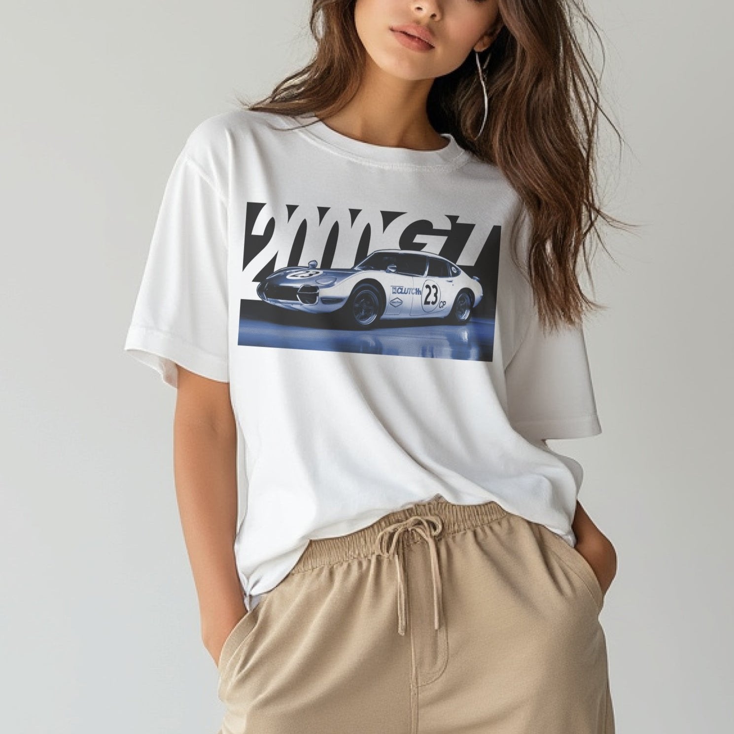 2000GT Automotive Graphic T-Shirt – White tee featuring a detailed graphic of the legendary Toyota 2000GT race car with bold "2000GT" lettering. Perfect gift for JDM and car culture enthusiasts.