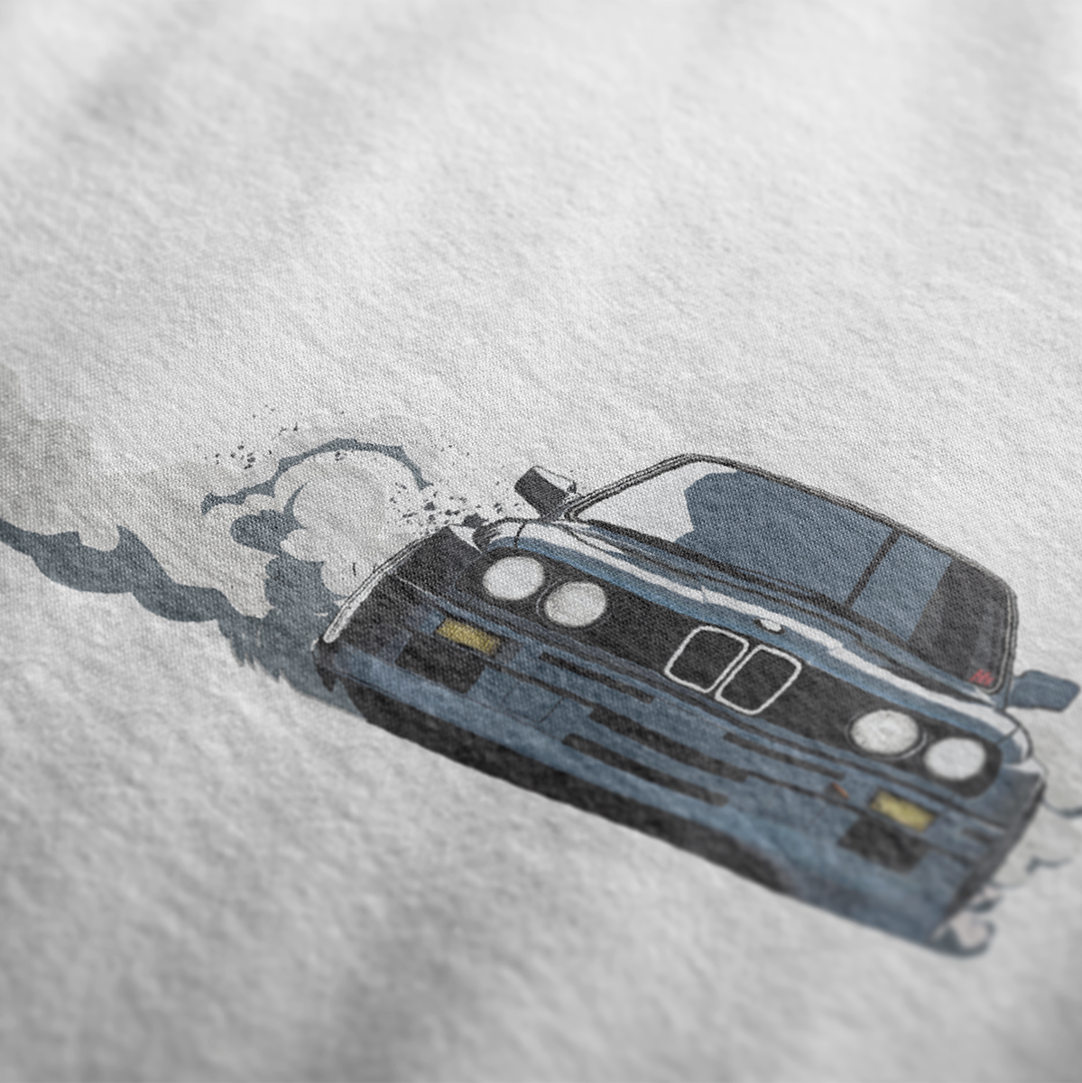 Close up of DTM M3 Drift Automotive Graphic T-Shirt Design – White unisex tee featuring a drifting BMW M3 graphic with smoke trail. A perfect gift for car enthusiasts and drift lovers.