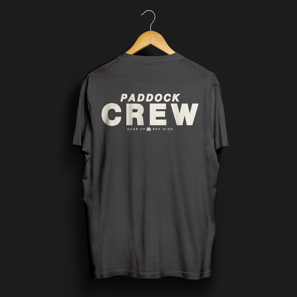 Paddock Crew Automotive T-Shirt – Back view of dark grey Paddock Crew graphic tee featuring bold &quot;Paddock Crew&quot; text and &quot;Gear Up, Rev High&quot; tagline. Perfect gift for motorsport and car culture enthusiasts.