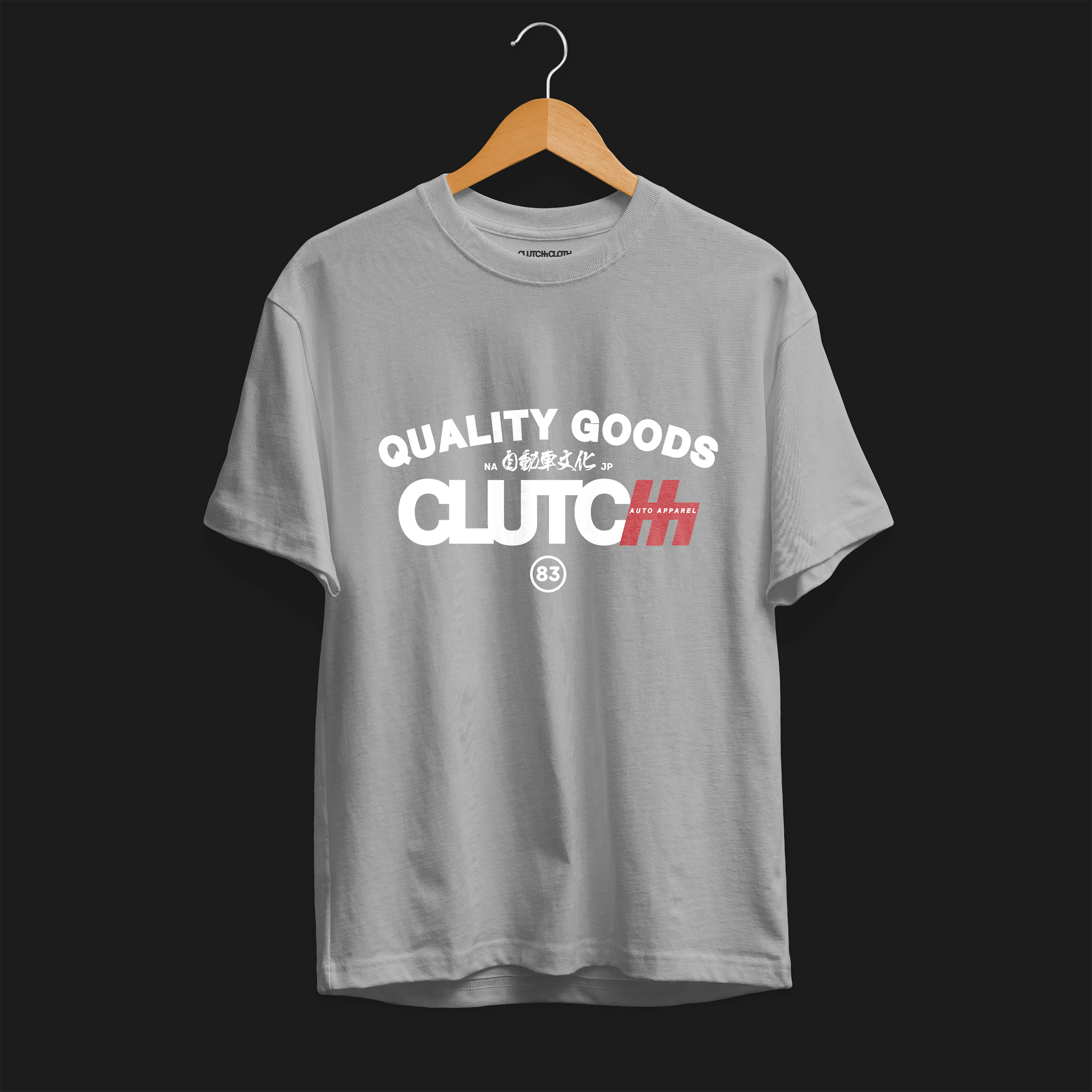 Quality Goods Car Culture 83 Automotive Graphic T-Shirt – front view sport grey tee with "Quality Goods" and "Clutch Auto Apparel" text, accented with Japanese characters and red highlights. Perfect gift for car enthusiasts and streetwear fans.