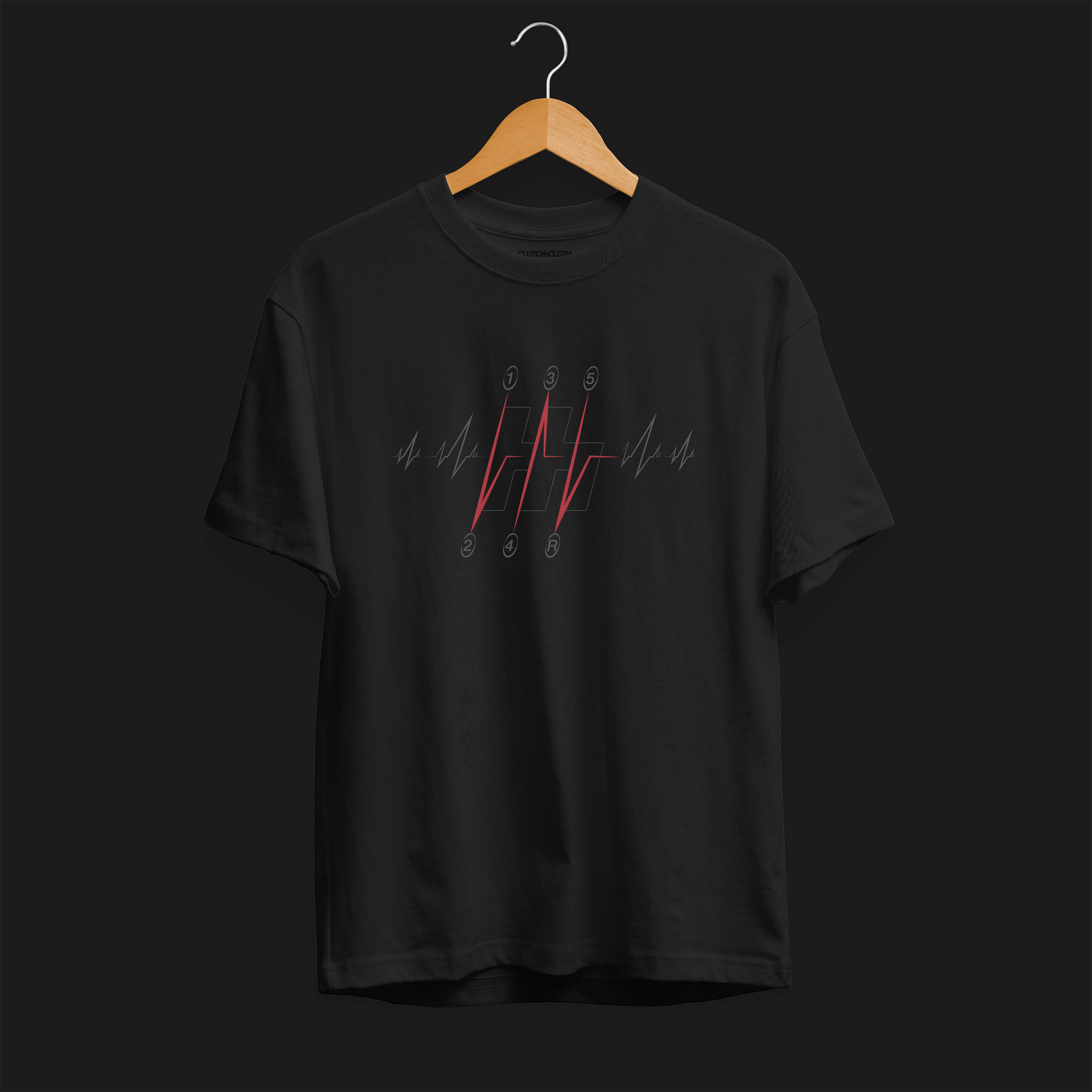 Manual Gear Shift Heartbeat Graphic T-Shirt – Black tee front featuring a red and gray manual gear shift with heartbeat accents. Perfect gift for car enthusiasts and manual transmission fans.