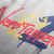 Verstappen 4th Time World Champion T-Shirt – White tee featuring bold Verstappen graffiti-style "4" design with a crown and red, blue, and yellow accents. Perfect gift for F1 fans and motorsport enthusiasts.